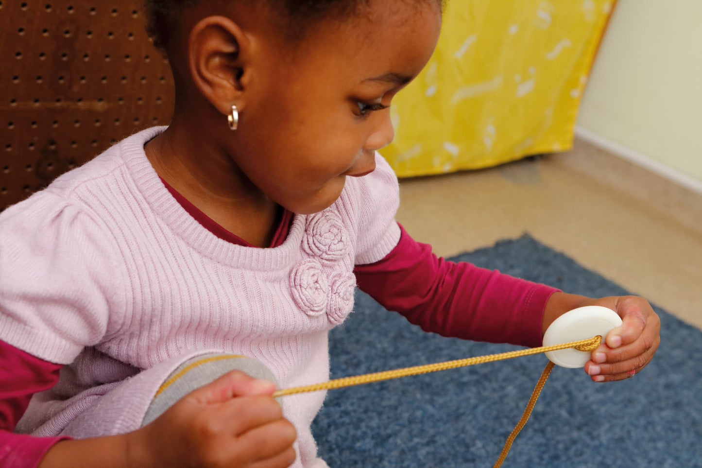 Count and Thread Stones Learning and Exploring Through Play